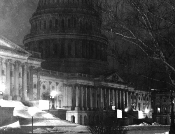 view of the Capitol at night in the snow (1907)