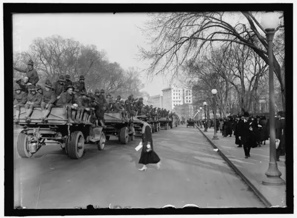 soldiers rolling through Washington on trucks