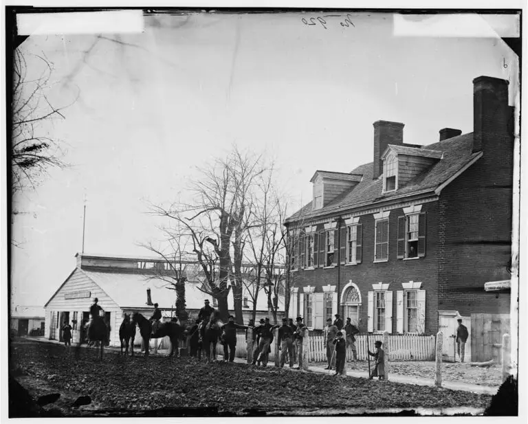 Quarters of General Alfred Pleasonton, and "Government Horse Shoeing Shop" at Left, 21st St. near F NW - Washington, D.C., April 1865