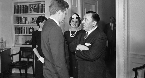 Thomas D’Alesandro Jr., former mayor of Baltimore, talks on March 28, 1961, at the White House with President John Kennedy after taking the oath to become a member of the Federal Renegotiation Board. Mrs. D’Alesandro and their daughter, Nancy (left), are in the background.