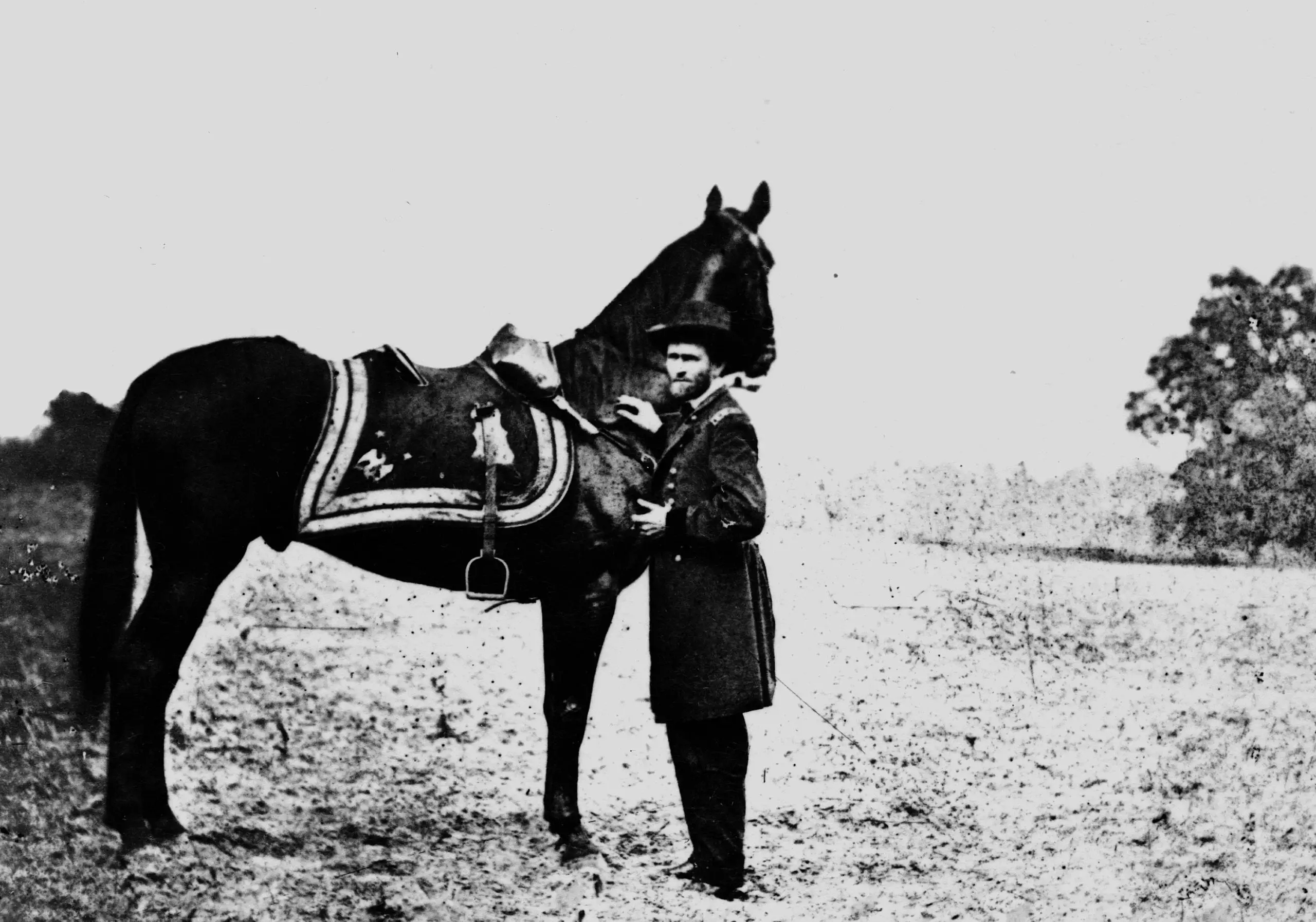 Ulysses S. Grant, full-length portrait, facing left, standing alongside his war horse, "Cincinnati"