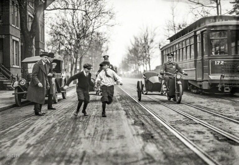 Washington, D.C., circa 1922. "NO CAPTION (Children, police motorcycles with sidecars, and streetcar in street)." From a series of photos whose subject seems to be traffic safety. Harris & Ewing Collection glass negative.