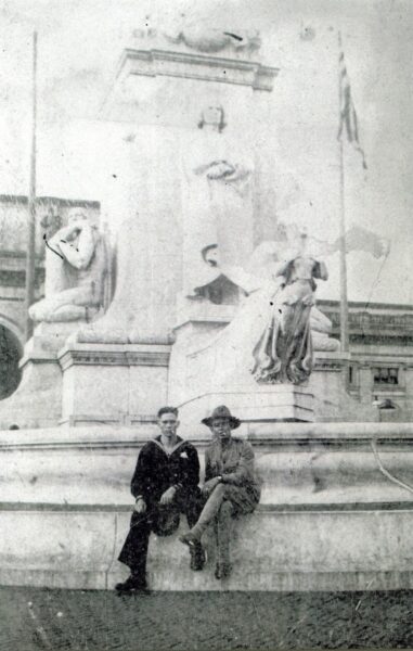 John Henry Balch, Corpsman, U.S. Navy, visiting Washington, D.C., in June 1917 [at Columbus statue at Union Station], while awaiting shipment overseas. The Marine on the right is not identified. [Portraits.] [Scene, World War I, World War 1.] John Henry Balch. 06/1917; NH 80571; Courtesy of Commander J.H. Balch, U.S. Navy (retired), 1974.