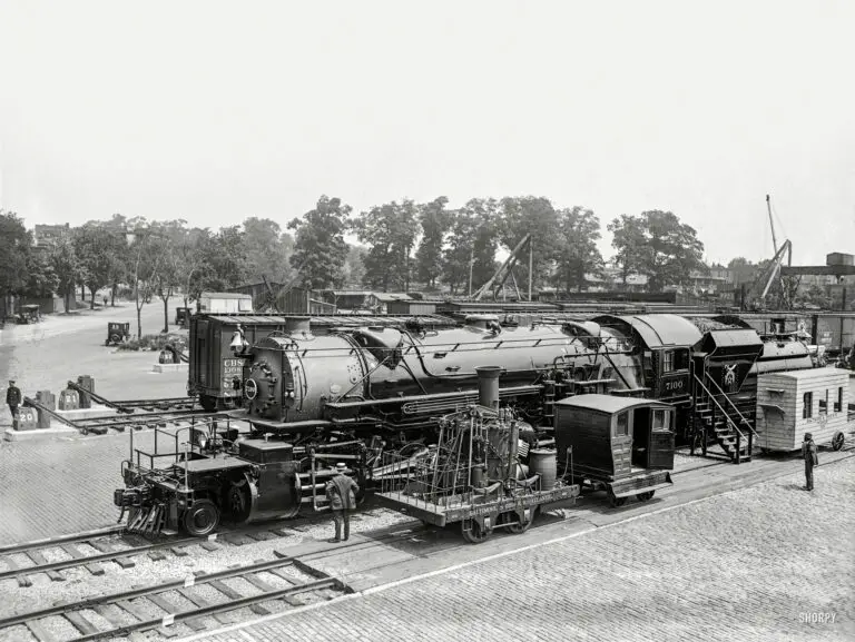 "Past and present in locomotives. Eckington Yards, June 4, 1923." A closeup of the locomotive in the Baltimore & Ohio rail yard during the Masonic convention in Washington, D.C. The big engine wears the livery of "Boumi Temple," a Baltimore Shrine lodge. 5x7 glass negative.