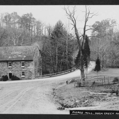 View of south and west elevations of Peirce Mill, to the left of Tilden Street NW as it rises to cross Rock Creek.