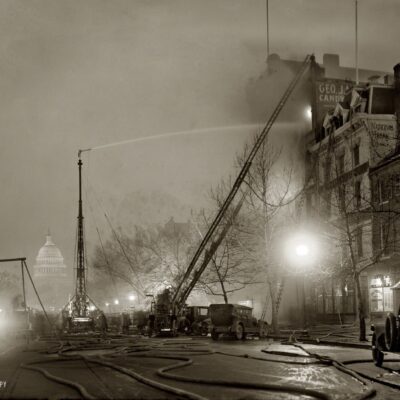 December 28, 1925. "G.J. Mueller Fire." A five-alarm fire at George J. Mueller Candy Co. in Chinatown at 336 Pennsylvania Avenue N.W., in view of the Capitol. National Photo Company Collection glass negative.