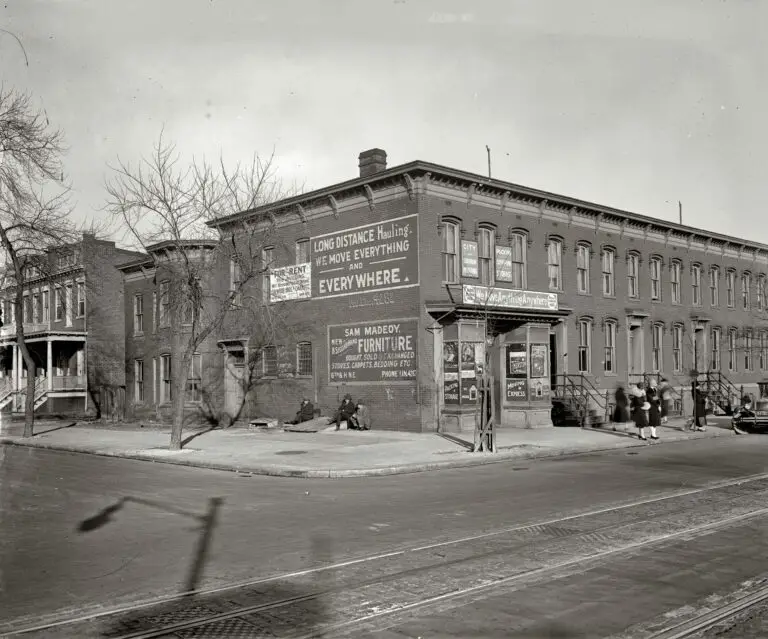 "Rowhouses and moving company." Circa 1925, the furniture and hauling business of Sam Madeoy at 600 H Street N.E. National Photo Company.