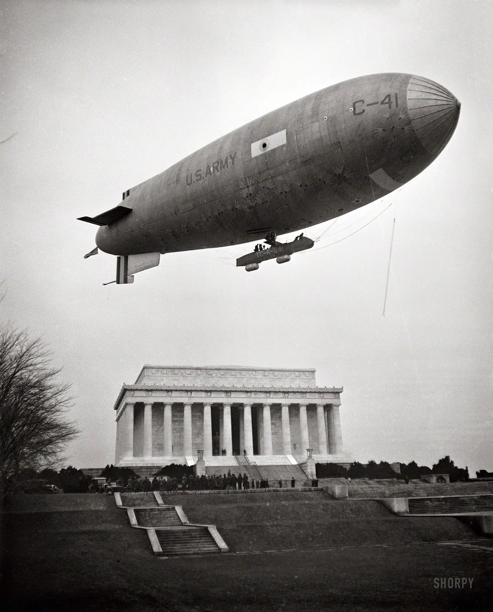 February 1930. Washington, D.C. "Army Airship C-41 lands on Mall and airmen, led by Brigadier General William J. Flood of the 19th Airship Company, place wreath at Lincoln Memorial, honoring Lincoln's Birthday."
