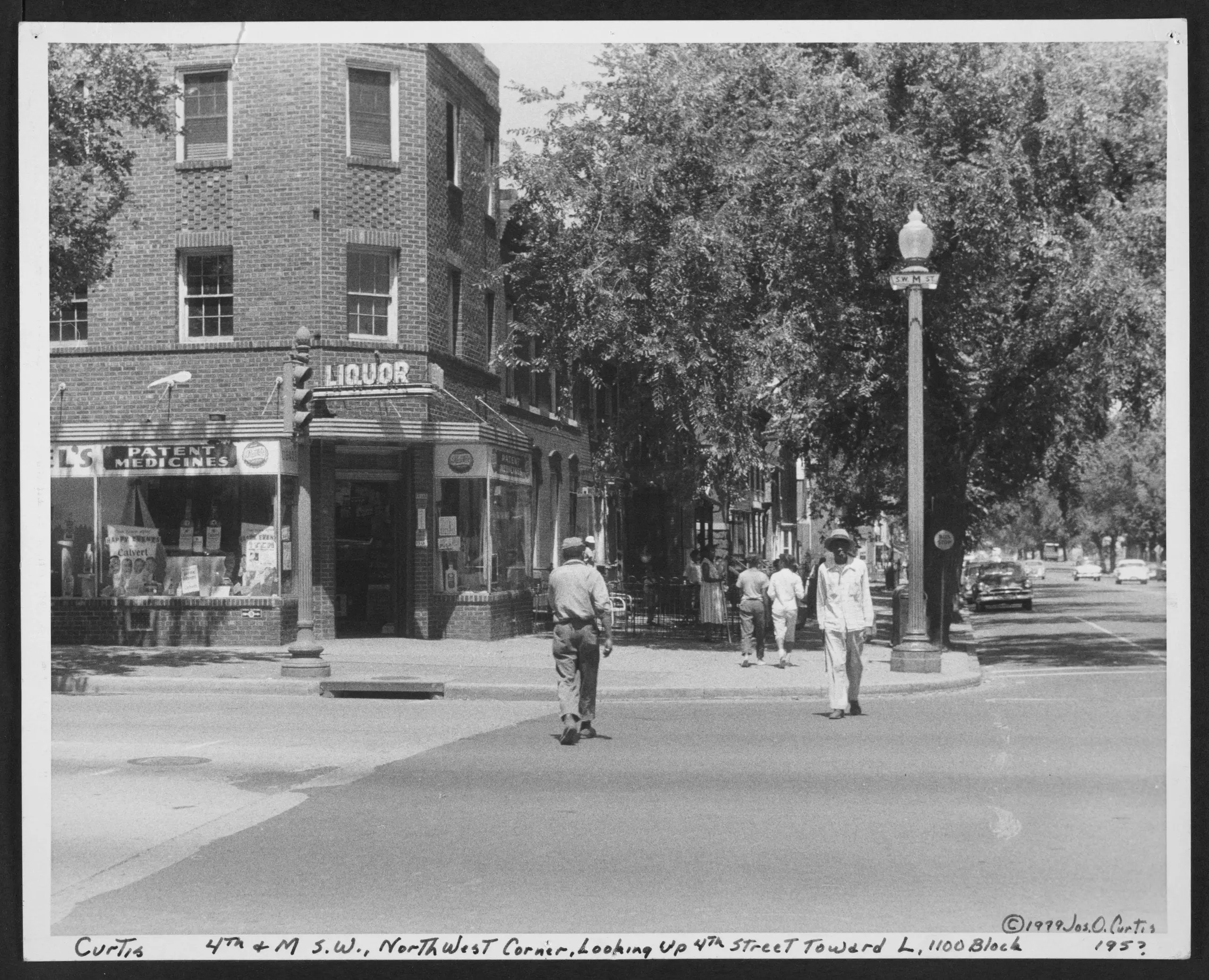 Corner store at 4th and M Streets SW, northwest corner, looking up 4th Street toward L, 1100 block
