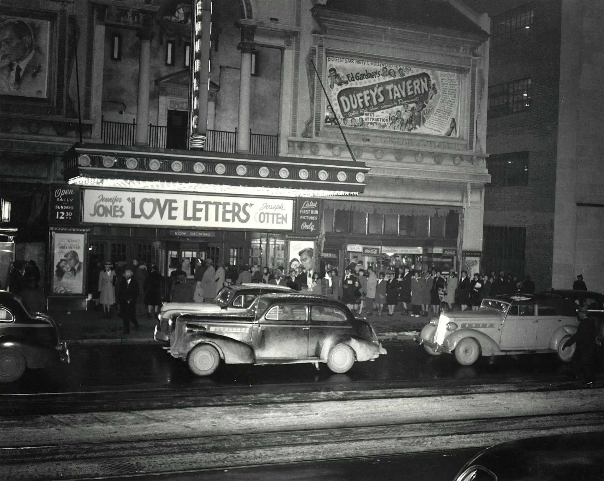 A crowd lines up for the movie, "Love Letters," starrring Jennifer Jones and Joseph Cotton, at the Republic Theatre on the north side of the 1300 block of U Street, 1945-1946.