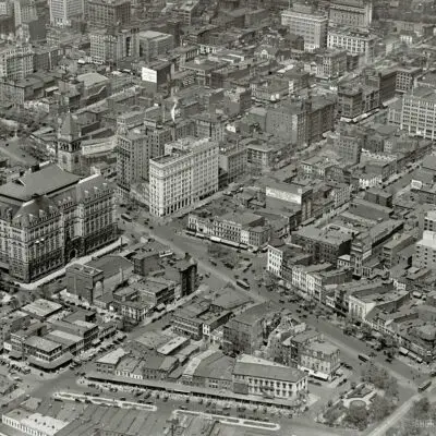Washington, D.C., circa 1922. "Star Building from air." The Washington Star newspaper building at the center is at the intersection of 11th Street N.W. and Pennsylvania Avenue, which runs diagonally across the photo. The big building with the tower us the Old Post Office. There's a lot to see here, including laundry hung out to dry. National Photo Company glass negative