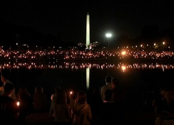 Thousands of people take part in a candlelight vigil on the National Mall in Washington D.C. September 12, 2001. (Photo: Reuters/Win McNamee/Newscom)
