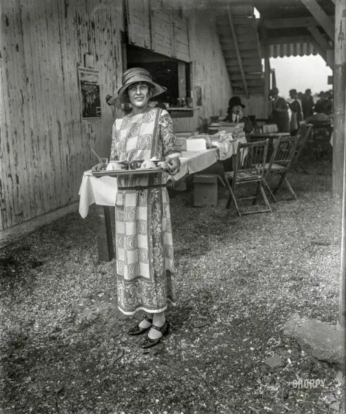 May 16, 1923. "Arlington Park, Virginia. Evelyn Wadsworth, daughter of Senator and Mrs. Wadsworth of New York, serving cold drinks at the National Capital Horse Show." Harris & Ewing Collection glass negative.