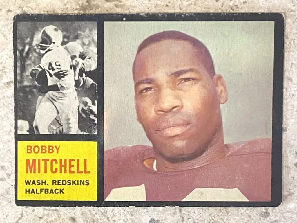 Bobby Mitchell's 1962 Topps football card, highlighting his significant role as a pioneering player helping the Redskins become last NFL team to integrate.