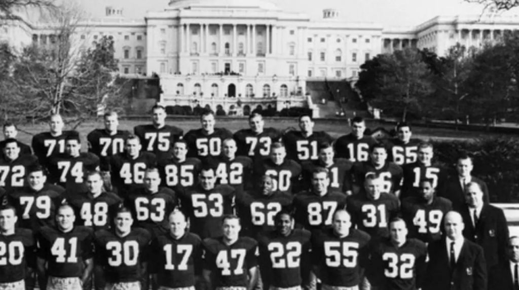 1962 Washington Redskins posing for a team photo with the Capitol Building in the background, notable as the last NFL team to integrate.