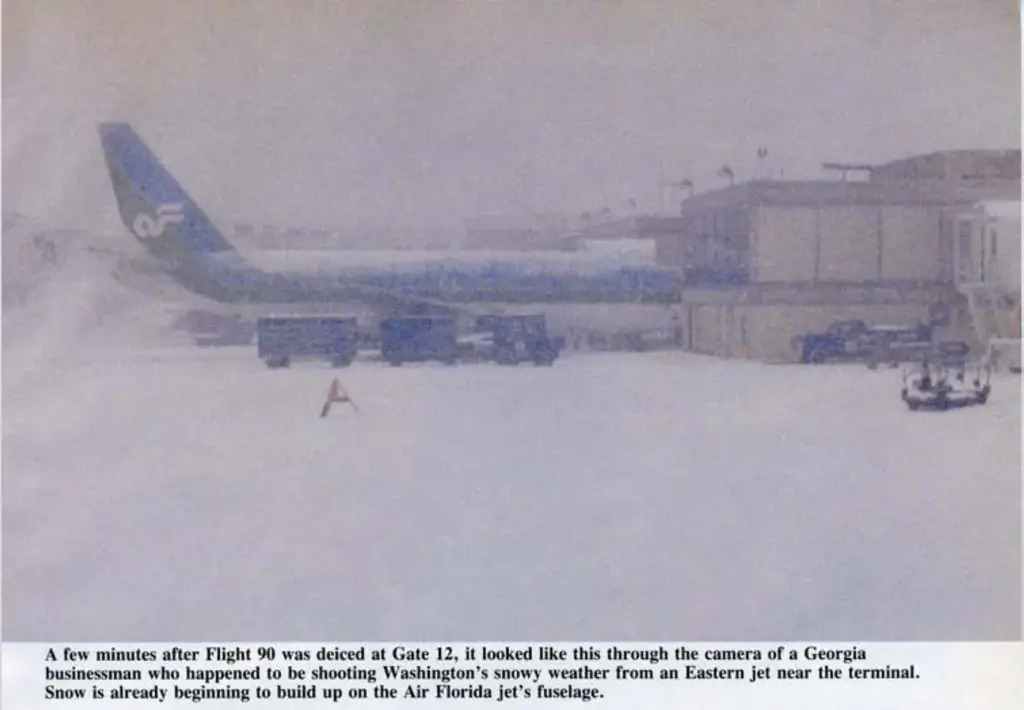 An airplane sits parked at an airport on a snowy day before taking off. This is Air Florida Flight 90 not long before it would be involved in a fatal crash in Washington D.C. on January 13, 1982.