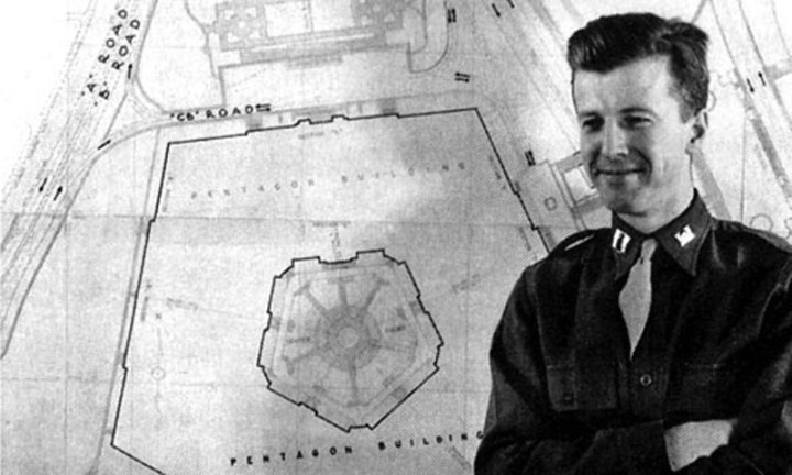 Army Capt. Robert Furman stands in front of a plan for the Pentagon circa 1941.
