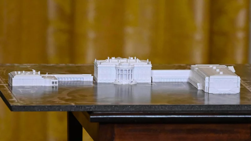 A model is seen as President Trump addresses a dinner for donors who have contributed to build the new ballroom at the White House on Oct. 15 in Washington, D.C. John McDonnell/AP