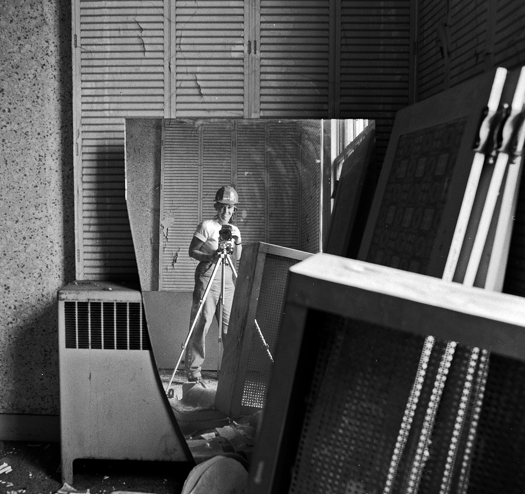 Self-portrait of photographer Carol M. Highsmith in a broken mirror during the Willard Hotel restoration