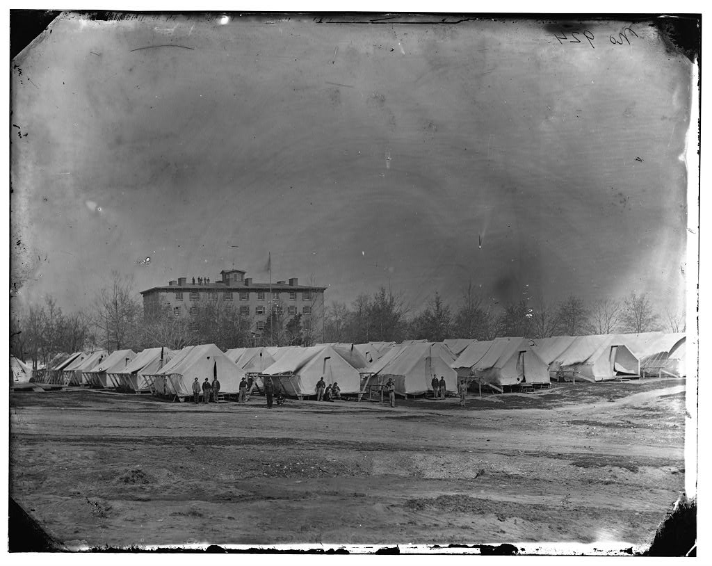 Hospital tents at Camp Carver on Meridian Hill with the Columbian College building in the background, Washington DC, circa 1862-1865