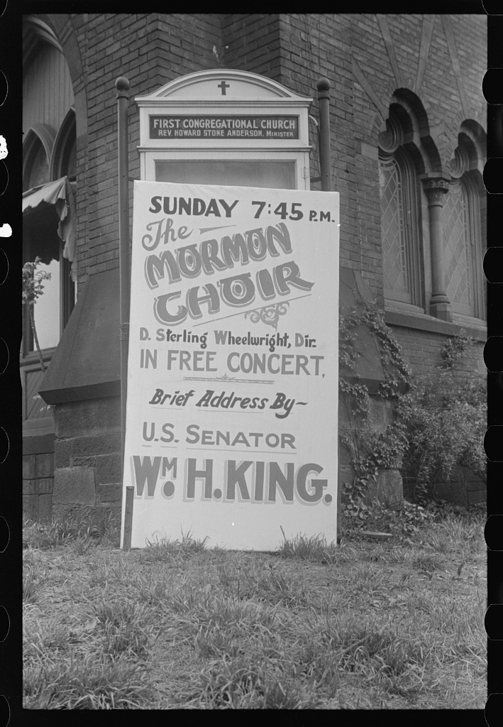 Bulletin board on the lawn of First Congregational Church in 1939 advertising a free Mormon Choir concert and an address by U.S. Senator William H. King