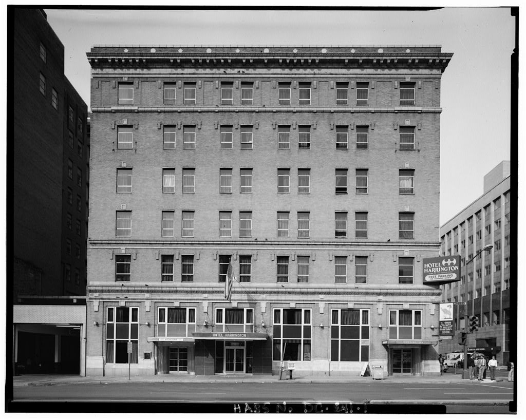 The Hotel Harrington building facade on 11th Street NW, showing the full height of the expanded hotel with its Hotel Harrington sign