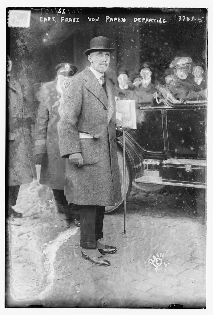 Captain Franz von Papen, German military attache, photographed in a long overcoat and bowler hat as he prepared to leave the United States in December 1915.