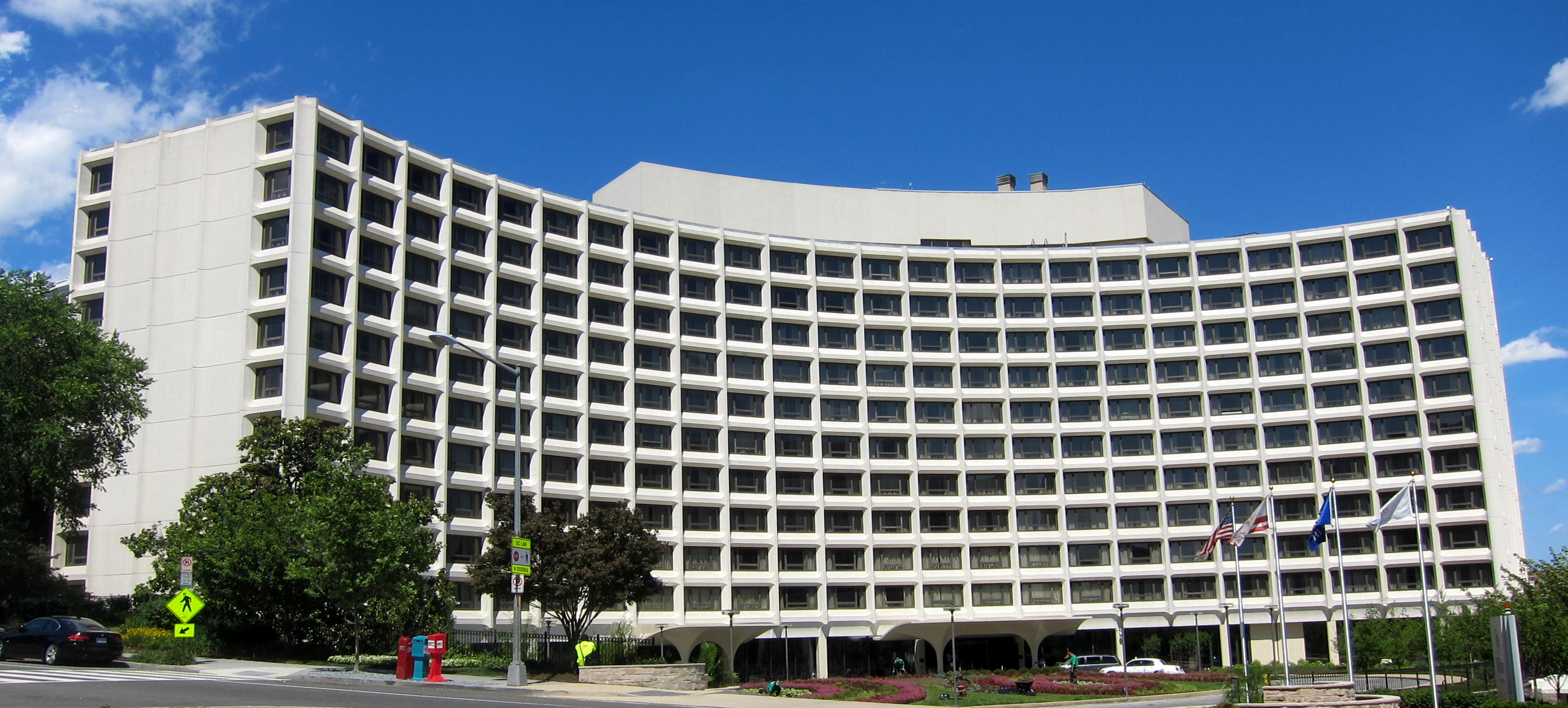 The Washington Hilton hotel at 1919 Connecticut Avenue NW, a wide concave curving modernist facade of white precast concrete panels built 1962-65 on the former Oak Lawn estate