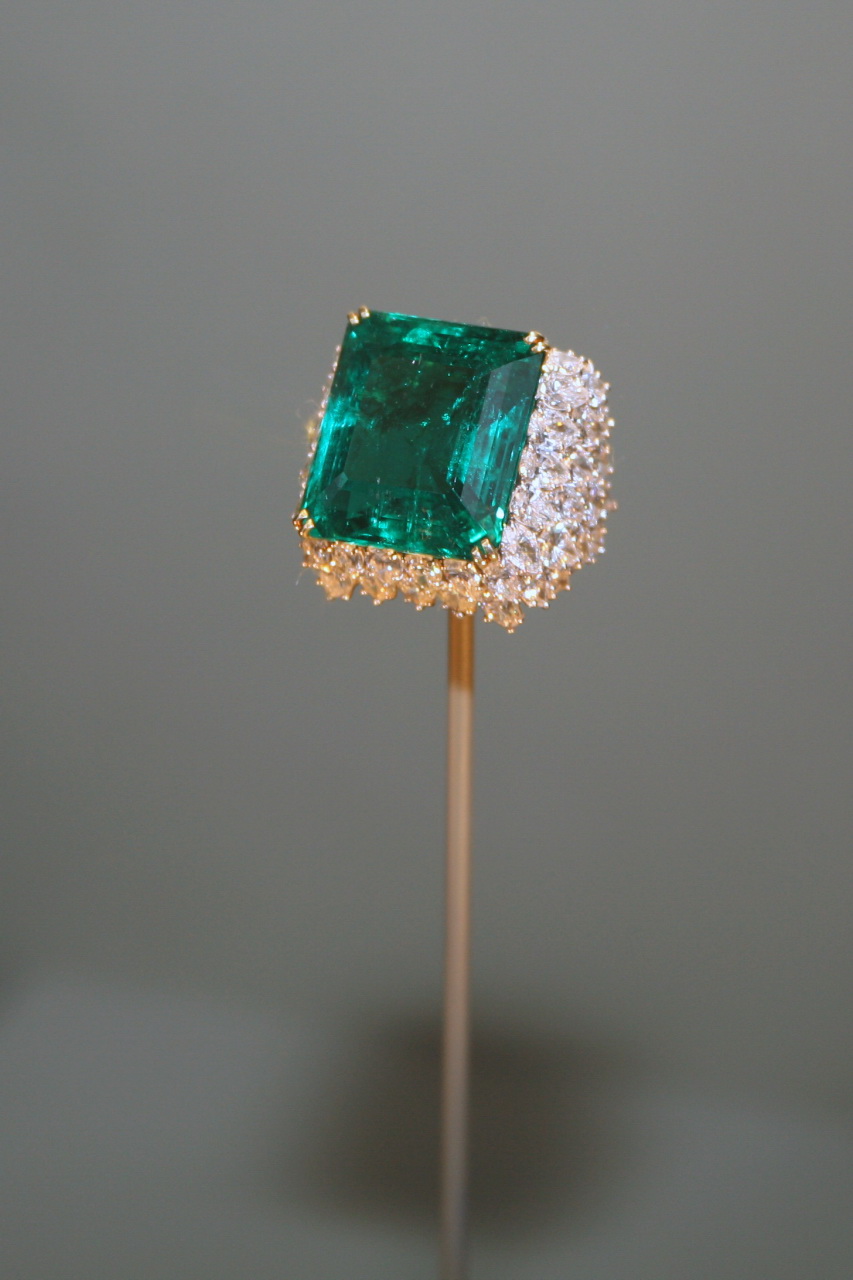 The Chalk Emerald, a deep green Colombian stone surrounded by sixty pear-cut diamonds in a platinum and gold ring setting
