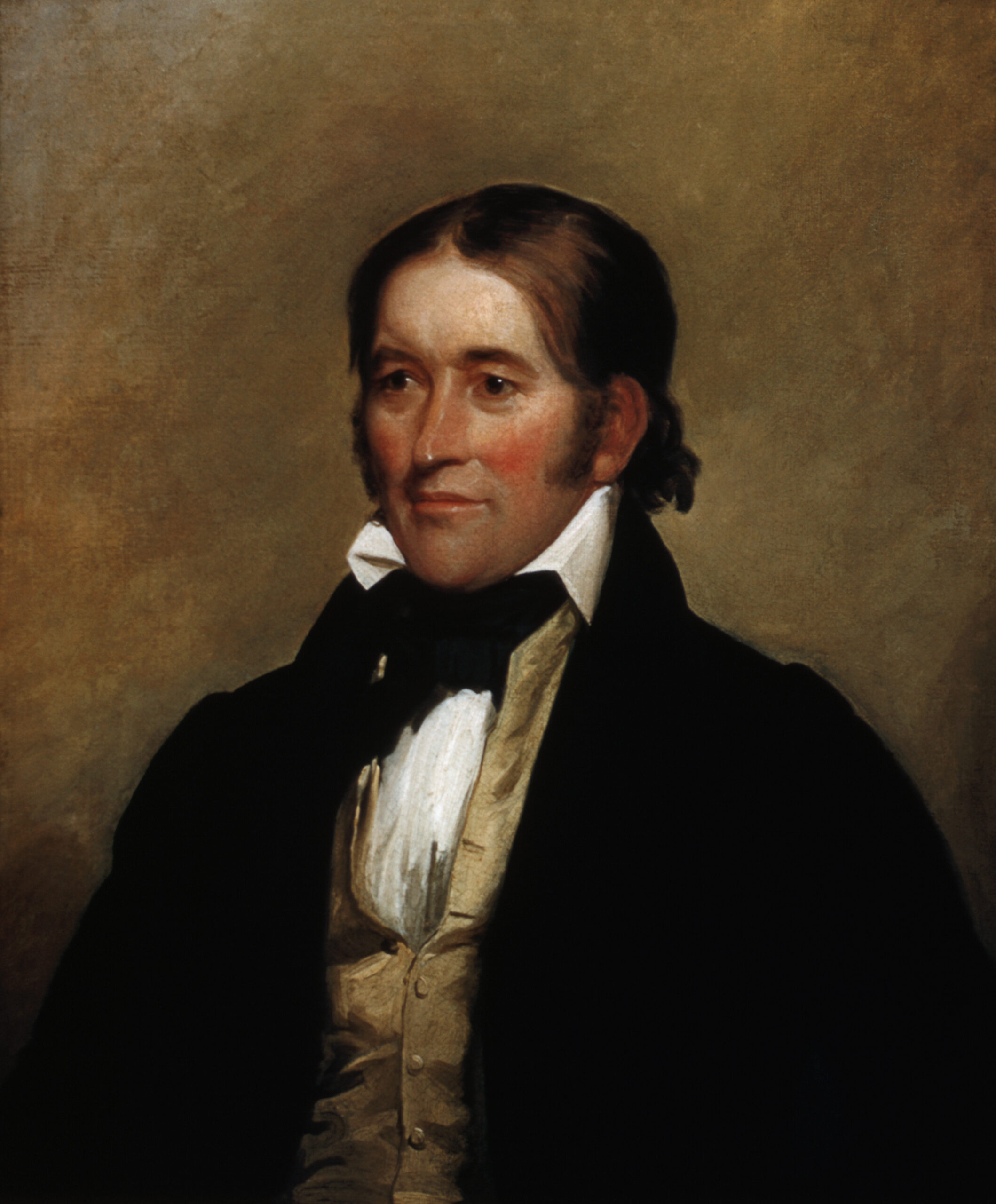 Oil portrait of David Crockett in 1834, painted by Chester Harding in Boston. Crockett is in formal dark suit and white cravat, hair brushed back, looking at the viewer.