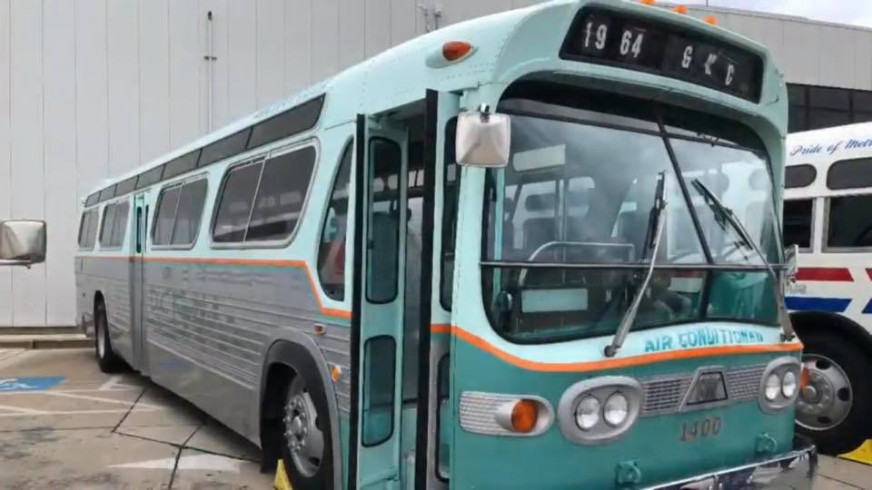 Restored DC Transit GMC Fishbowl bus number 1400 in green, white, and coral livery