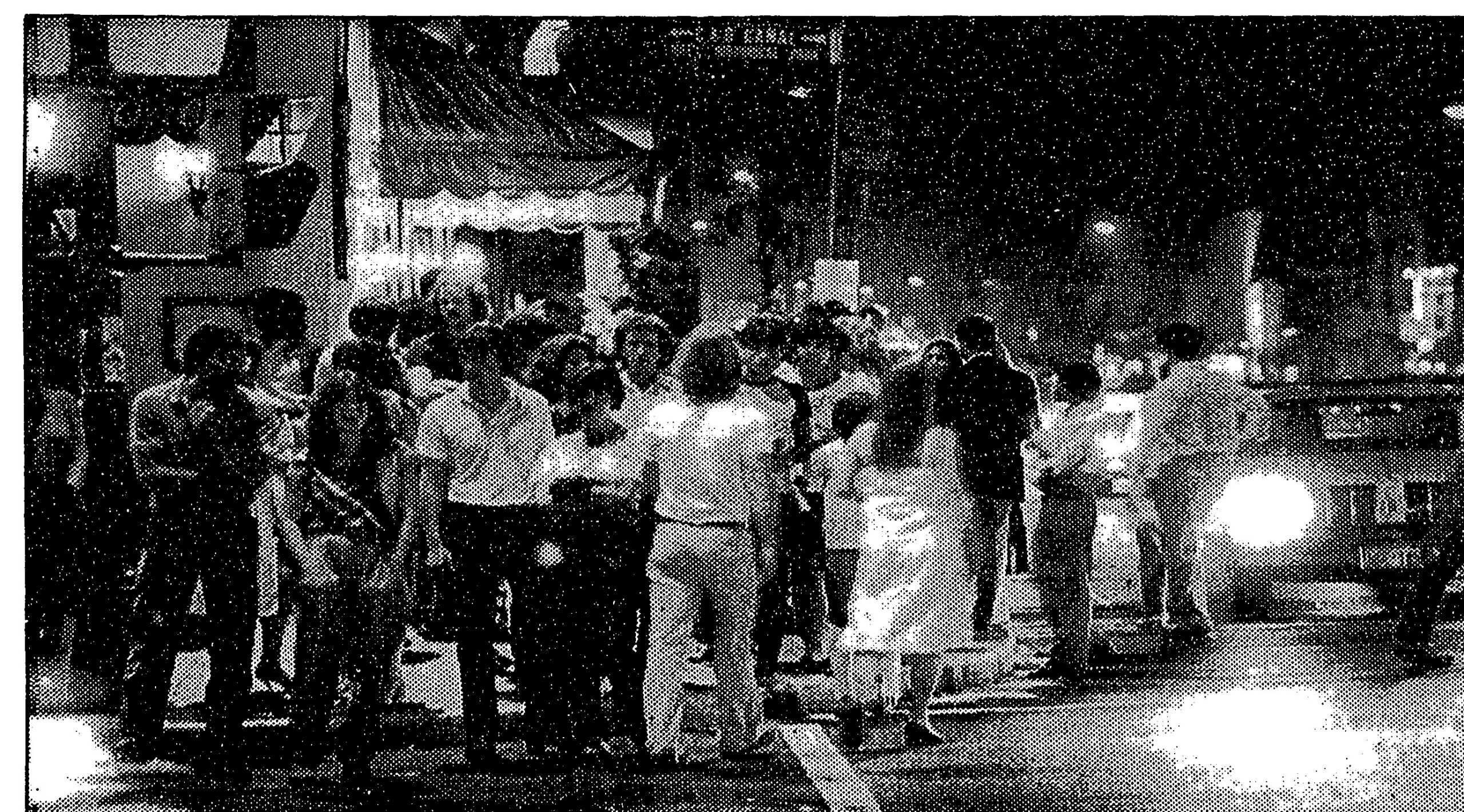 Crowds at the corner of M Street and Wisconsin Avenue in Georgetown at midnight, 1982