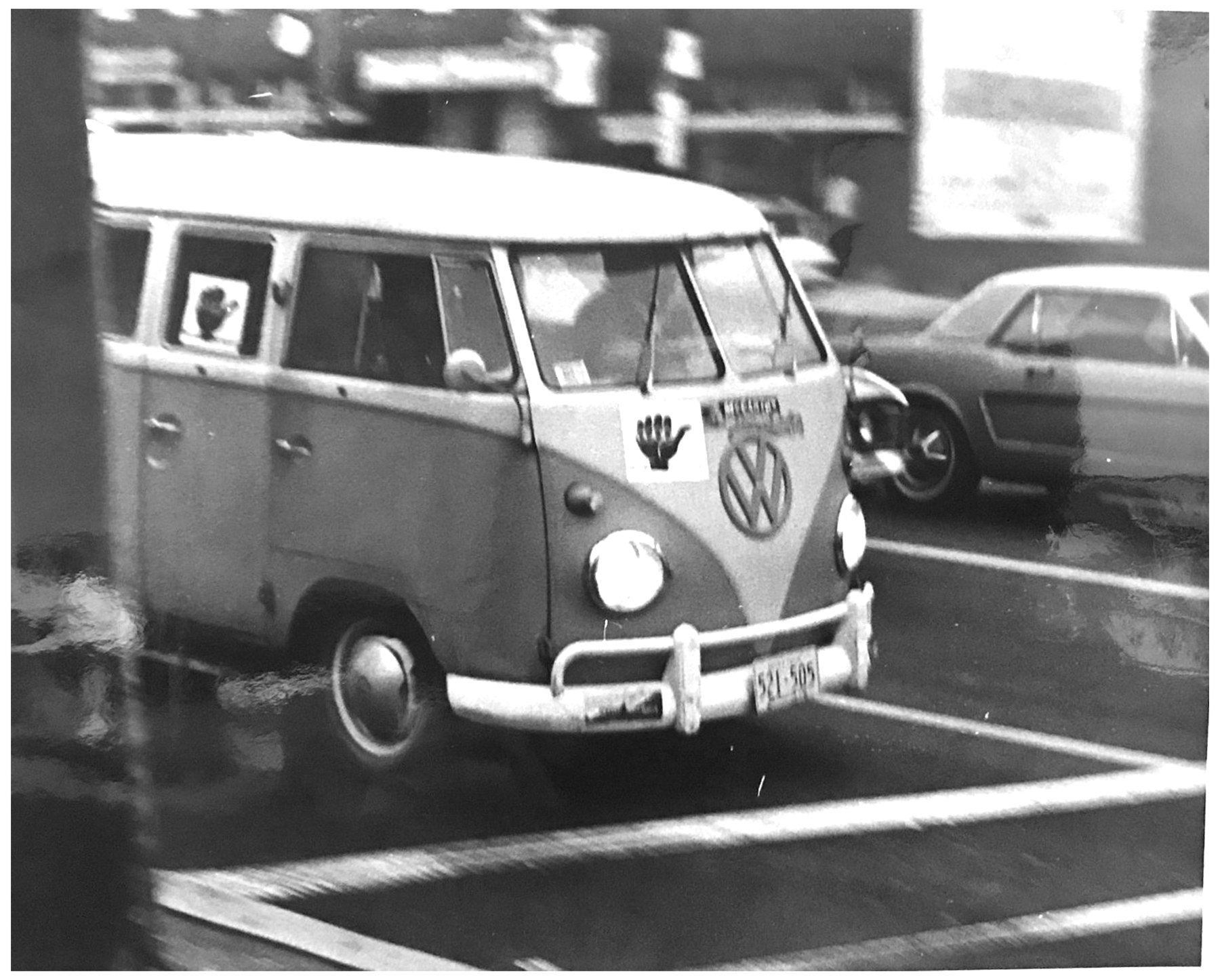 A Volkswagen minivan marked with the hitchhiker thumb signaling a designated boycott carpool moves down H Street NE on December 2, 1968