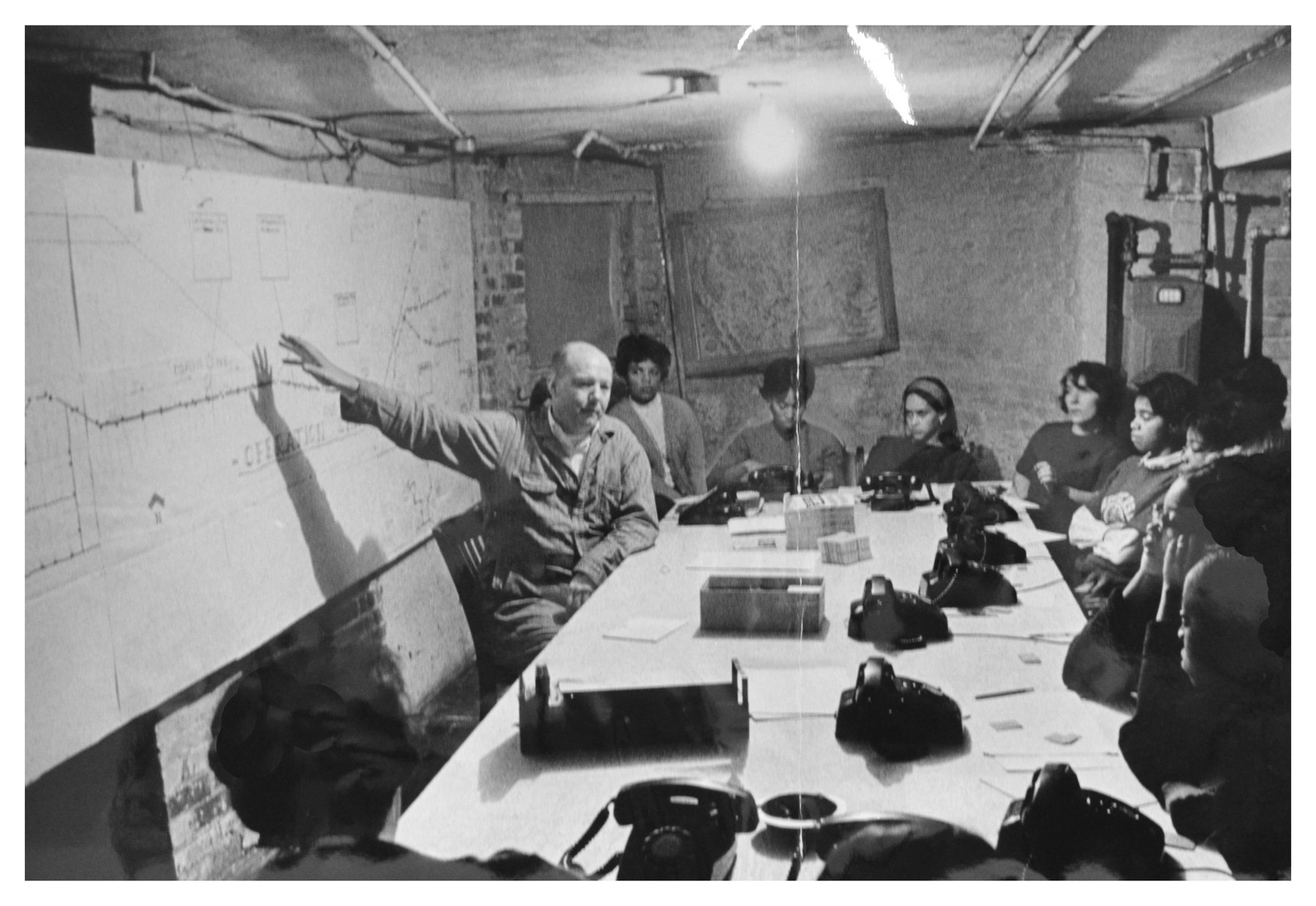 SNCC volunteers receive last-minute instructions for the January 24, 1966 D.C. bus boycott from D.C. coordinator Lowell D. Pratt