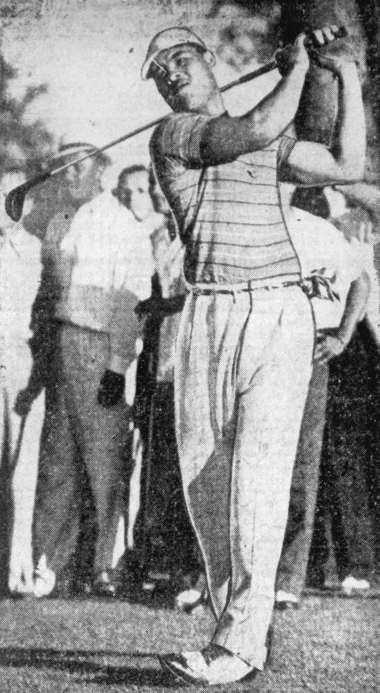 Heavyweight boxing champion Joe Louis on a golf course in 1945