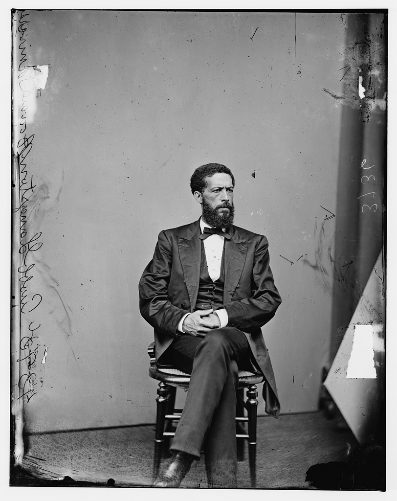 Studio portrait of John Mercer Langston in formal coat