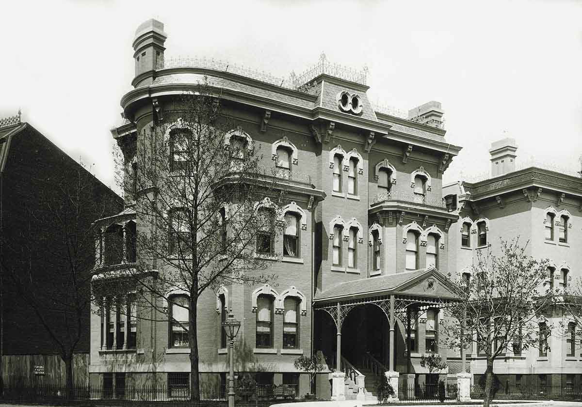 Period photograph of the Korean Legation building at 1500 13th Street NW showing the original porte-cochère and decorative roof railing
