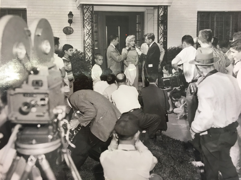 Marilyn Monroe stands on the front walk of 3625 Appleton Street NW in Forest Hills, Washington DC, holding a brief press conference surrounded by neighborhood children on May 23, 1957.