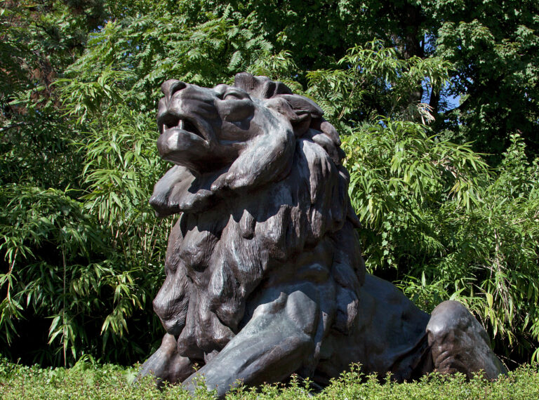 Lion statue at the front gate of the Smithsonian National Zoological Park on Connecticut Avenue in Washington DC