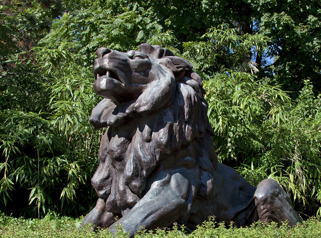 Lion statue at the front gate of the Smithsonian National Zoological Park on Connecticut Avenue in Washington DC