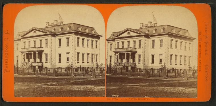 Sepia stereoview showing the U.S. Naval Hospital in Washington with a flag over the cupola and a dirt road in front