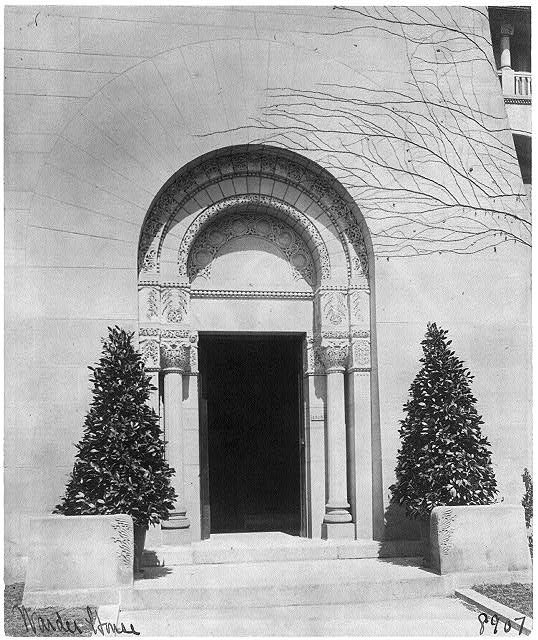 The carved Romanesque entrance of the Warder Mansion around 1900