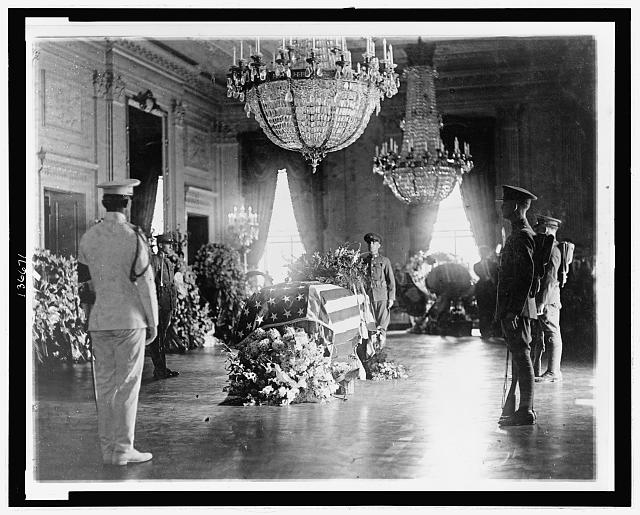 President Warren G. Harding's flag-draped casket lying in state in the East Room of the White House, August 1923.