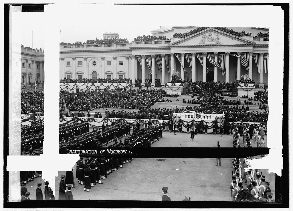 Chief Justice Edward D. White administering the oath of office to Woodrow Wilson on the East Portico of the U.S. Capitol, March 4, 1913.
