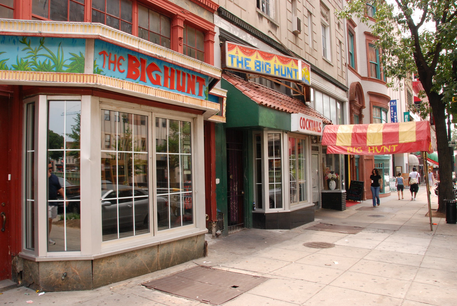 The Big Hunt at 1345 Connecticut Avenue NW in July 2008, mid-run, with the striped circus-tent awning and the jungle murals that defined the storefront for nearly three decades. Photo by Kevin Harber, used under Creative Commons.