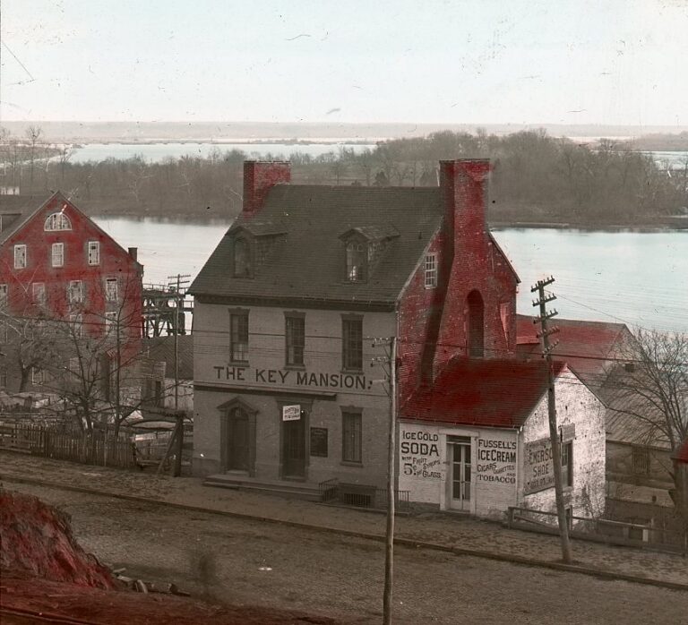 The Francis Scott Key Mansion at 3516-18 M Street NW in Georgetown, its gabled roof and chimneys intact, with the Potomac River behind it.