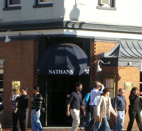 Exterior of Nathans Restaurant at 3150 M Street NW Georgetown, with the dark blue NATHANS awning and people walking past on the sidewalk
