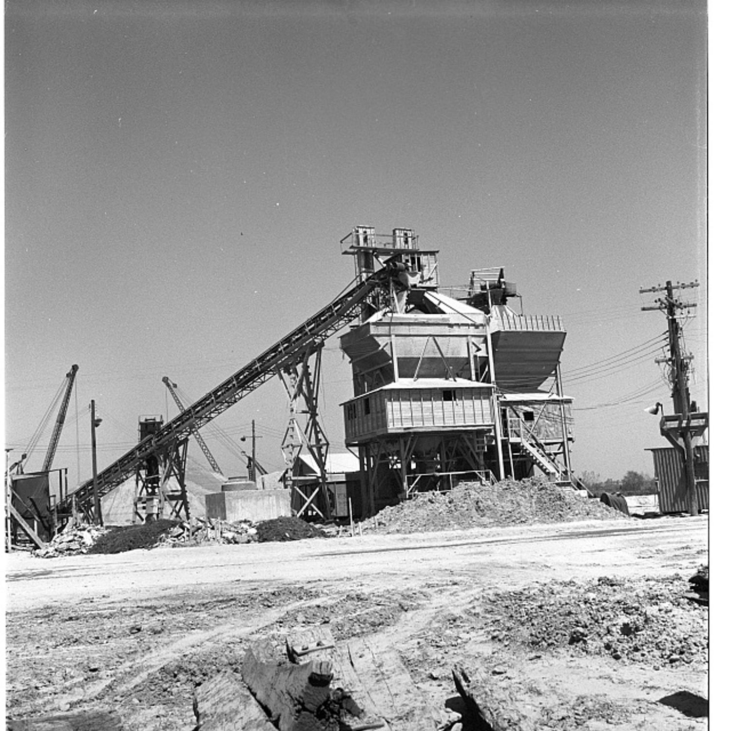 The on-site concrete batching plant at the Pentagon construction site with conveyor belts feeding the mixer tower, 1942