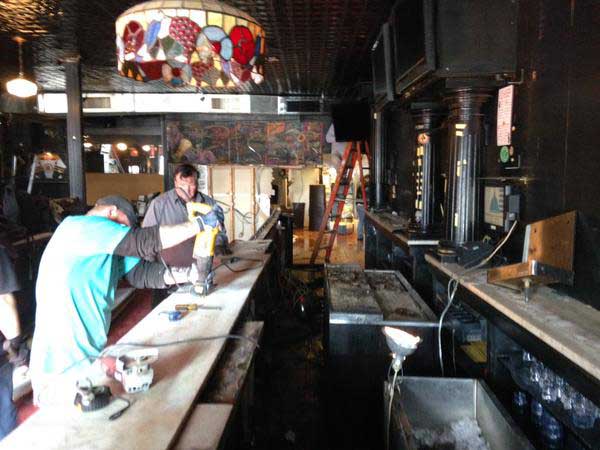 Workers cutting the Rhino Bar downstairs marble bar after the 2015 auction