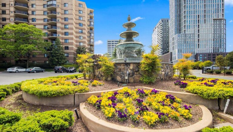 The Rotonda McLean main entrance fountain on Greensboro Drive with two of the curved condo towers in the background